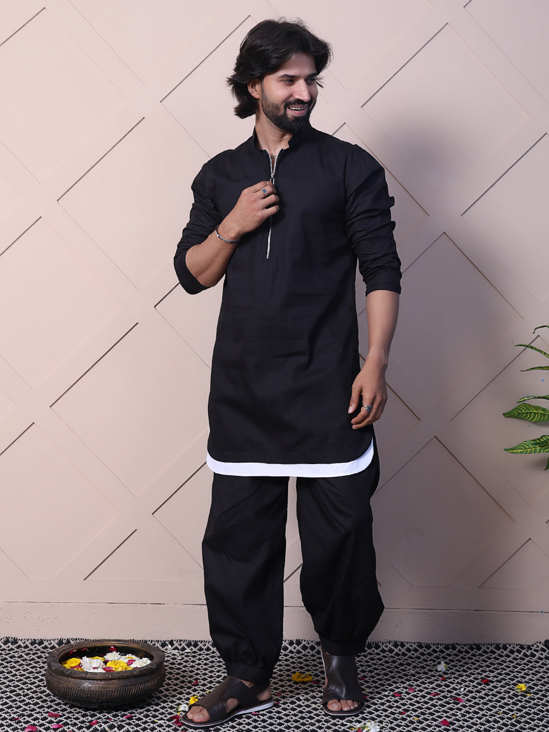 Black kurta with a rounded hem and zip closure