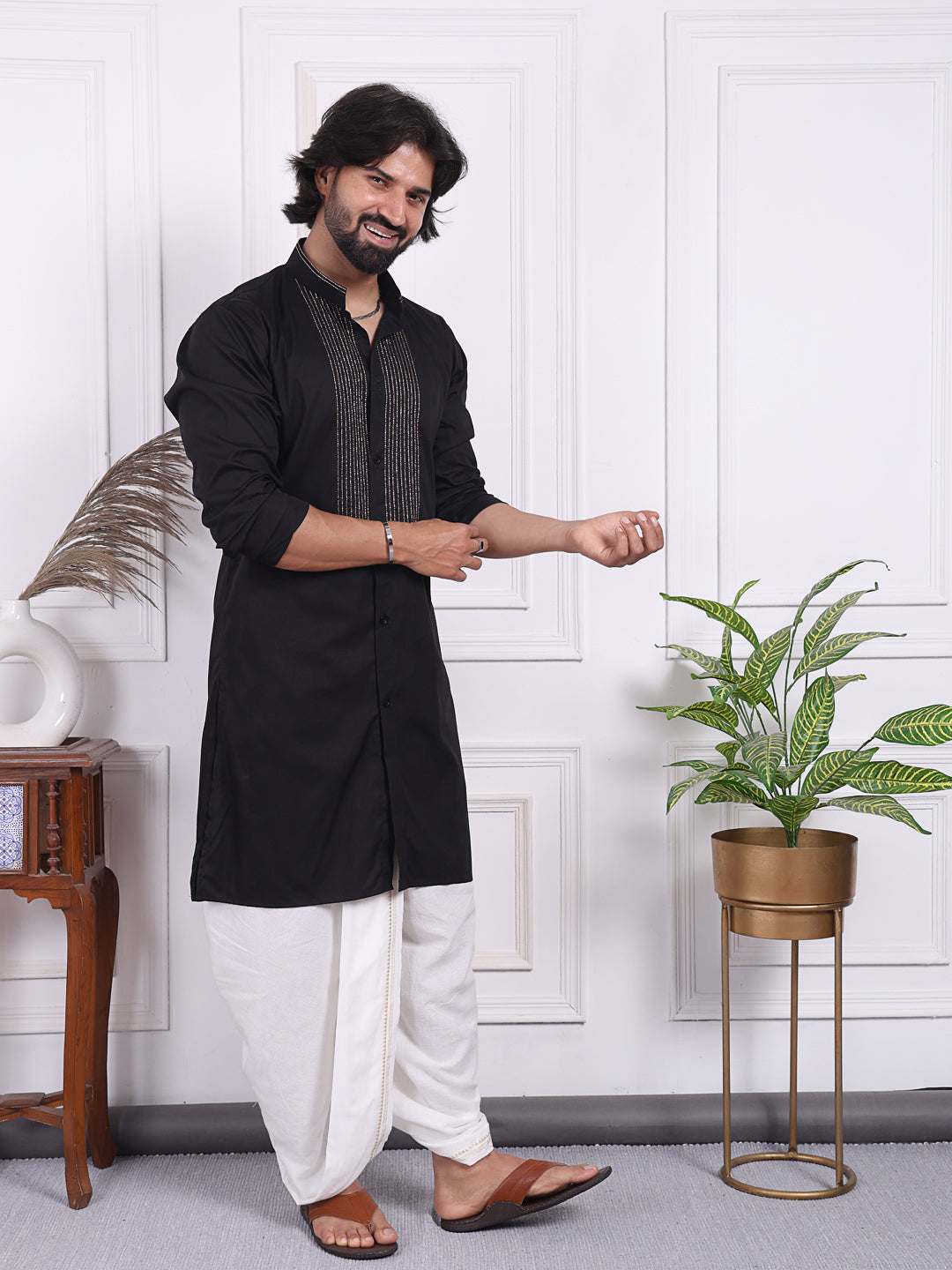 Black kurta with golden thread accents on the front