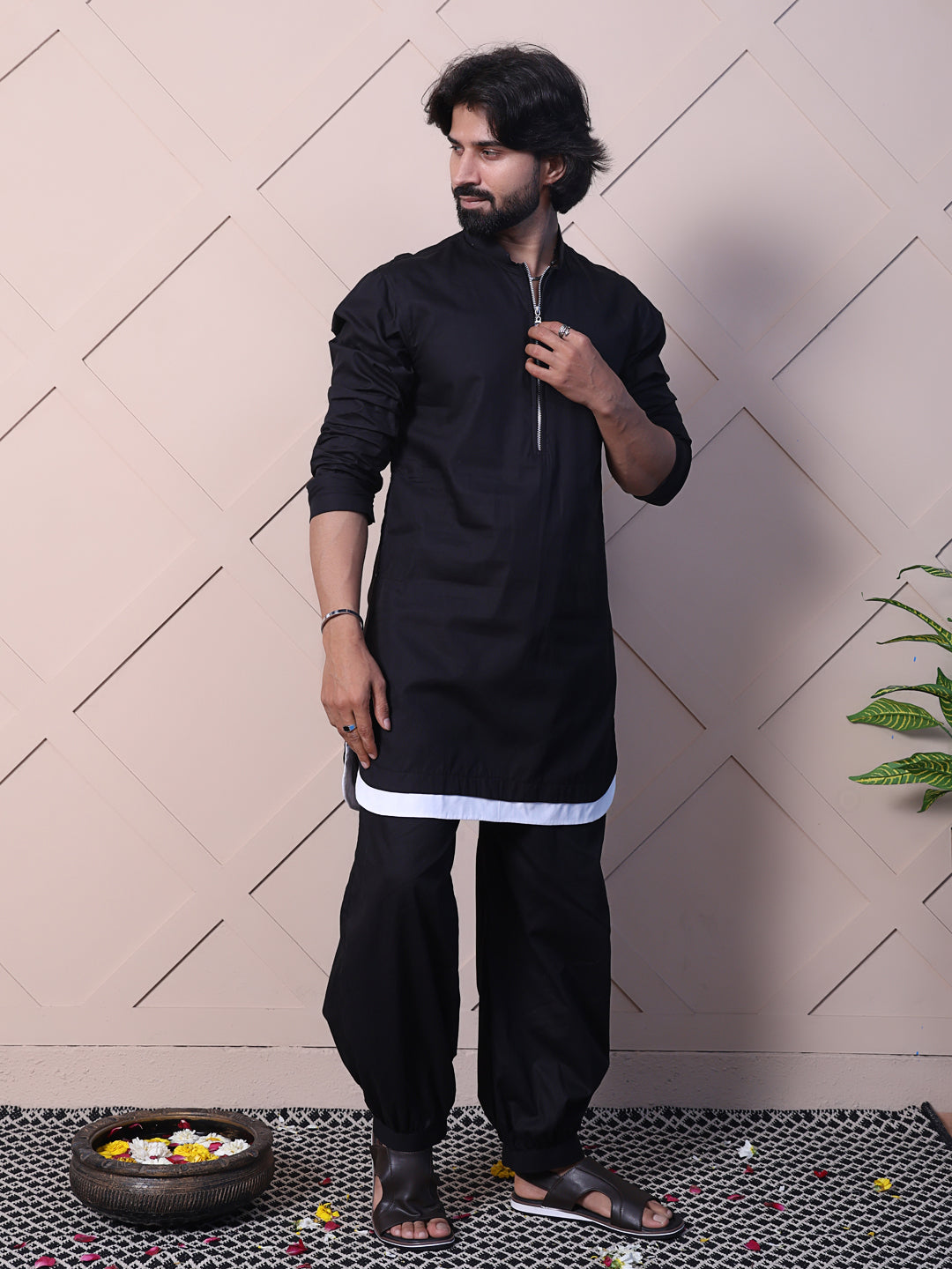 Black kurta with a rounded hem and zip closure