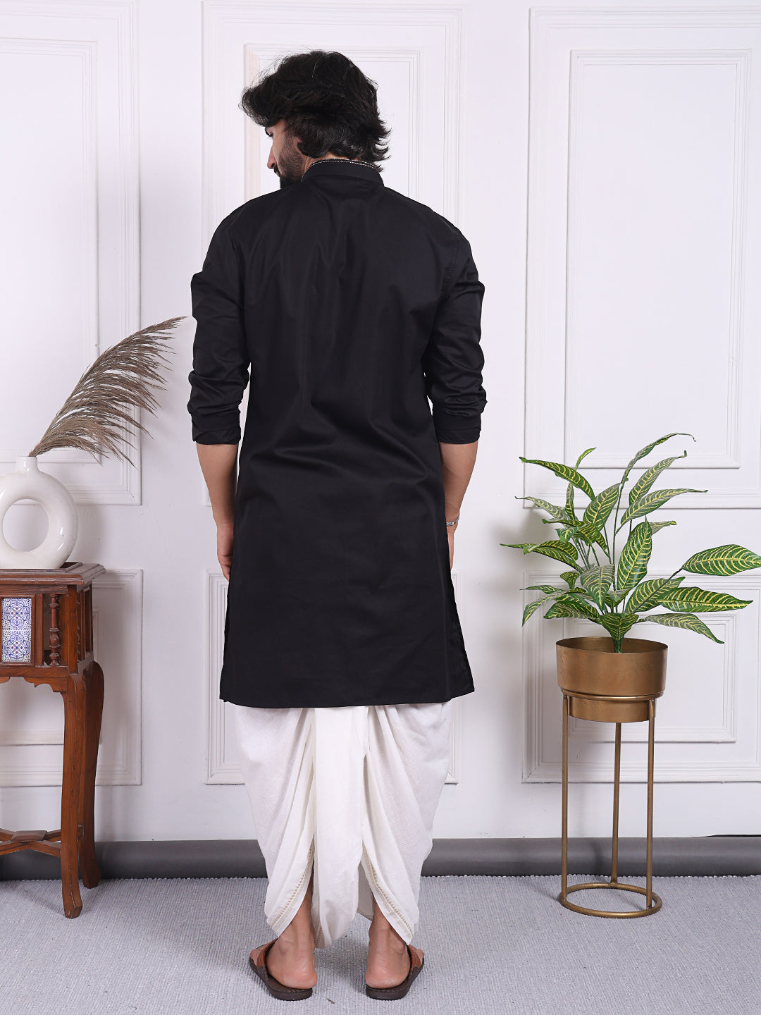 Black kurta with golden thread accents on the front