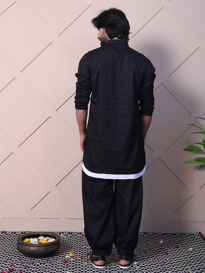 Black kurta with a rounded hem and zip closure