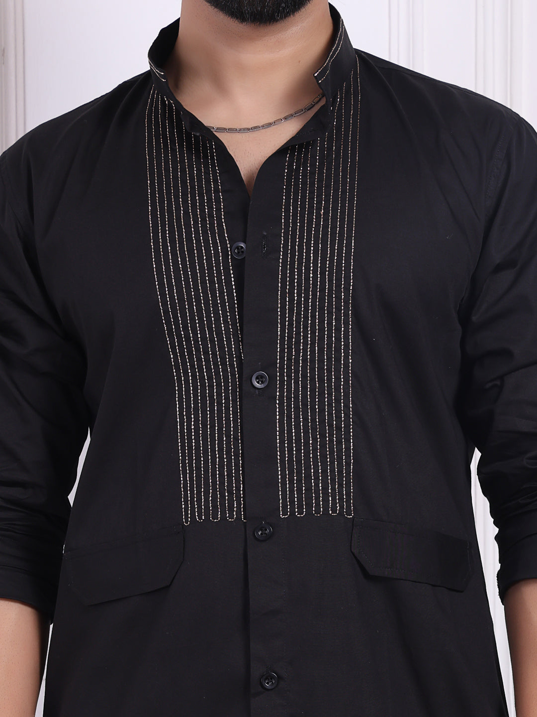 Black kurta with golden thread accents on the front