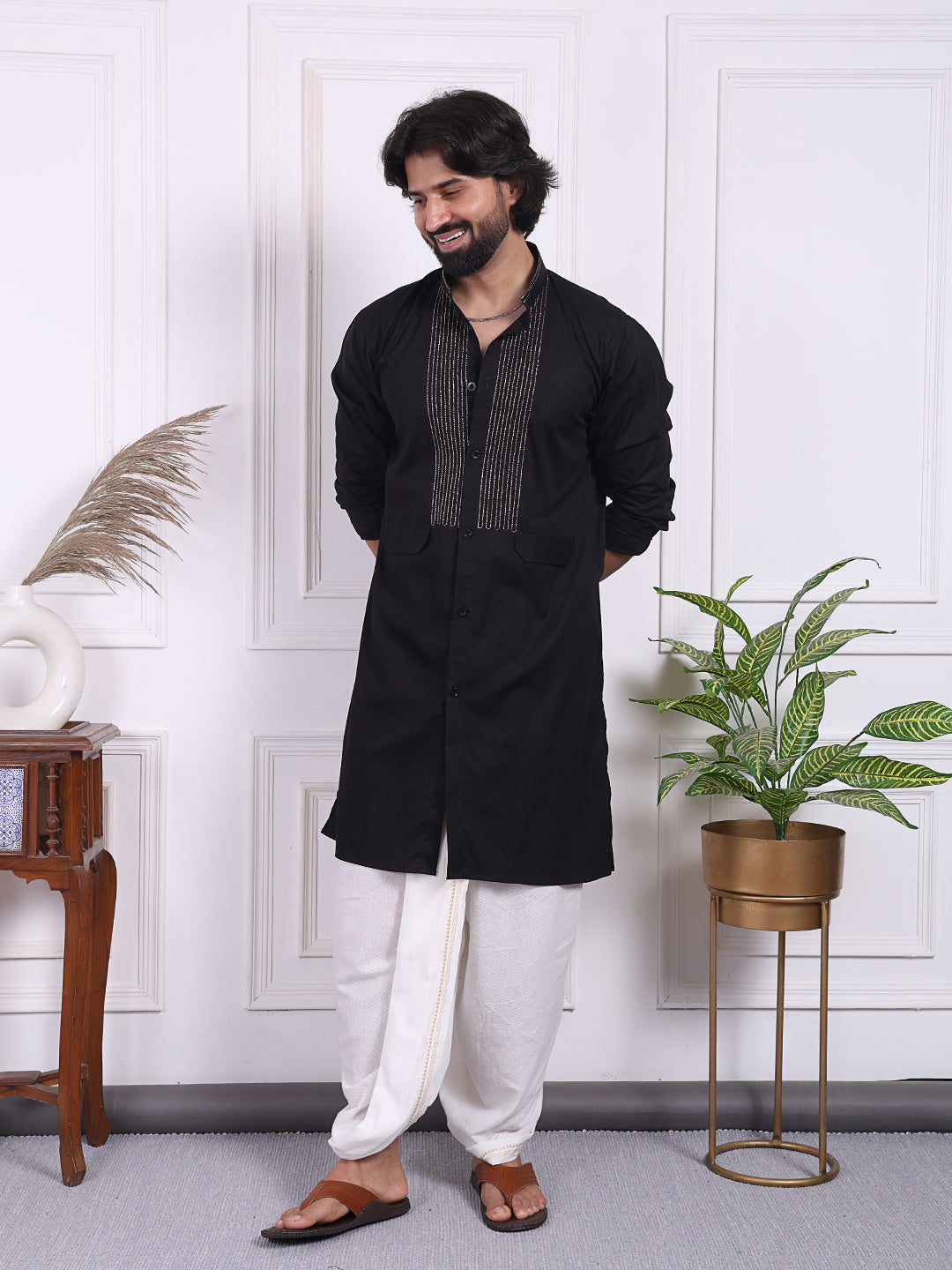 Black kurta with golden thread accents on the front
