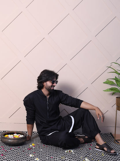 Black kurta with a rounded hem and zip closure